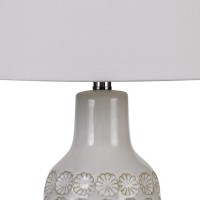 Emblaze your existing decor setting by bringing in this contemporary style Table Lamp which comes with a 3 way rotary switch and is wrapped with a linen hardback shade Supported on a floral engraved ceramic base it will be a perfect addition to your home