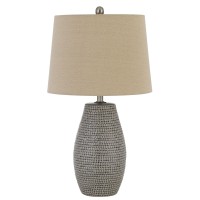 Embellished with beautiful looking textured details in gray hue it has pot bellied shaped silhouette which gives a convenient look The burlap fabric tapered shade in beige hue grants the most pleasing look 100W bulb is required to bring out the most perfe