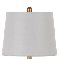 Bring the most enchanting look in the interior setting of the home with the inclusion of this table lamp available in set of 2 The circular shaped body with embossed honeycomb pattern adds a tint of glam and touch to it The contrasting golden hue brings t