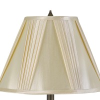 Create the enchanting vibe in the ambience with the inclusion of this table lamp Depicting pedestal style body it has floral and leaf accents which adds artistic and creative look to it The faux silk shade with pleated design makes it a style statement wi