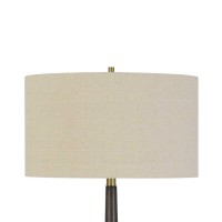 Glorify your furnishing with the inclusion of this contemporary style 63 inch Floor Lamp Incorporating a drum shape beige fabric shade it is supported on a step metal and wooden base With its appealing aesthetics it is sure to elevate your decor setting