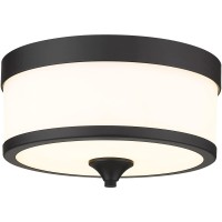 This stylish modern threelight flushmount ceiling light from the Cosmopolitan collection offers a touch of Art Deco flavor adding simplicity with a twist to a kitchen dining space or bedroom An etched milk white shade is trimmed with bold matte black fini