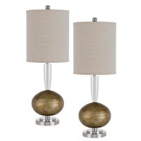 Combining metal and crystal material this lovely modern table lamp set is topped with a tall drum shade It features a striated wide bottom base with a light bronze finish The elegant and versatile lamp works well with many different types of dcor and styl