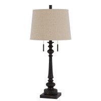 Add a rustic touch to your space with this rustic iron resin table lamp It features a matte hammered finish on a slim pole style body It has a pull chain onoff design and round hardback fabric shade completes the look