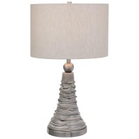 Representing creativity at its best this table lamp surely captivates everyone with its distinct design Showcasing flared pedestal style body it has wavy pattern which adds to the overall beauty and also makes it enticing 3 way socket switch and E 26 bulb