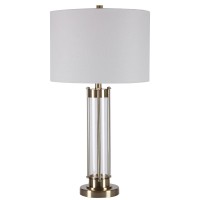 Perfect for a study desk or home office this elegant Table Lamp lends contemporary appeal to your home Supported on a stacked base accented with golden brass finish it incorporates a drum shape white fabric shade It elevates the aesthetics of any home and