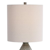 This elegant piece of table lamp is here to brighten up the entire setting and fill the room with an aesthetic appeal Crafted from ceramic the pot bellied shape body with diamond pattern adds to the creativity of the piece 3 way socket switch and E 26 bul