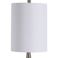 Featuring contemporary style this pot bellied shaped table lamp crafted from ceramic will simply make a style statement Resting atop round shaped metal base it has cylindrical shaped fabric shade which allows the light to filter through and create a pleas