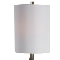 Featuring contemporary style this pot bellied shaped table lamp crafted from ceramic will simply make a style statement Resting atop round shaped metal base it has cylindrical shaped fabric shade which allows the light to filter through and create a pleas