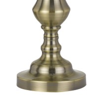 Elevate your sense of style and choice with the inclusion of this sturdily constructed table lamp available in set of 2 The turned pedestal style body in brass hue adds a touch of vintage and antique appeal to it The tapered drum shade compliments its loo