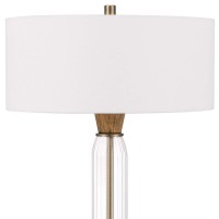 Emblaze the aesthetics of your interior by bringing in this contemporary style inspired Table Lamp which comes with a round fabric drum shade Incorporated with wood and glass accent base it is sure to be a remarkable addition to your place