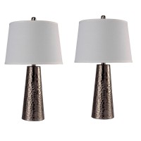 Attract the attention of all the guests with the minimalistic and charming look of this table lamp Depicting contemporary style with hammered pedestal base and topped with inverted tapered shade complements the look and makes it worth adding that offers a