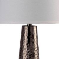 Attract the attention of all the guests with the minimalistic and charming look of this table lamp Depicting contemporary style with hammered pedestal base and topped with inverted tapered shade complements the look and makes it worth adding that offers a