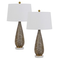 Emblaze your existing decor setting by bringing in this contemporary style Table Lamp available in a set of 2 It comes with a 3 way intensity switch and wrapped from a hardback shade that requires a 150watt bulb each Rests atop on honeycomb pattern metal 