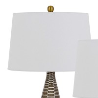 Emblaze your existing decor setting by bringing in this contemporary style Table Lamp available in a set of 2 It comes with a 3 way intensity switch and wrapped from a hardback shade that requires a 150watt bulb each Rests atop on honeycomb pattern metal 