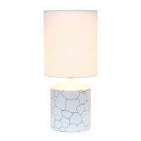 Spruce up the lighting in your home with this fashionably designed table lamp A beautiful repeat pattern printed on the base is paired effortlessly with a clean white fabric shade With a variety of color and print options available you are bound to find t