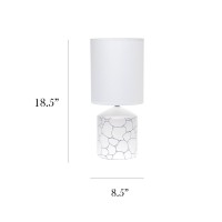 Spruce up the lighting in your home with this fashionably designed table lamp A beautiful repeat pattern printed on the base is paired effortlessly with a clean white fabric shade With a variety of color and print options available you are bound to find t