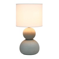 With two ceramic stones vertically nested atop one another this lamp stands at just under 16 in height A beautiful fabric drum shade completes this modern look This is the perfect accent piece to illuminate your space of choice