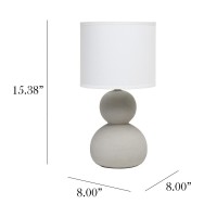 With two ceramic stones vertically nested atop one another this lamp stands at just under 16 in height A beautiful fabric drum shade completes this modern look This is the perfect accent piece to illuminate your space of choice