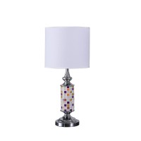 Brighten up your aesthetics like never before with the inclusion of this table lamp Crafted from metal it has a cylindrical body with a glass cut out mosaic pattern that adds to the beauty The uno fitter shade allows the light to filter through it The on 