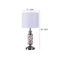 Brighten up your aesthetics like never before with the inclusion of this table lamp Crafted from metal it has a cylindrical body with a glass cut out mosaic pattern that adds to the beauty The uno fitter shade allows the light to filter through it The on 