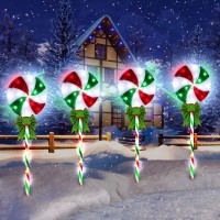 DONSAJI Lollipop Peppermint Christmas Pathway Lights Outdoor and You Spend a Happy Christmas Together Features Quantity 4 pack Main colors red white and green Number of beads 80 LEDs Size 275 inch high 71 inch width Power supply lowvoltage plug power supp