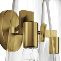 The Beacon Wall Sconce updates a living space bedroom dining room bathroom hallway entryway or office with minimalist sleekness that makes a modern statement Offering a warm glow through its slim glass cone shades this wall light is mounted to the wall by