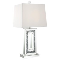 Glimmering dark crystallike accents emerge from the base interior of this stunning contemporary table lamp A narrow base outlined in mirror tile accents the edges creating a beveled look Mirror tiles also line the flush base further lending to the reflect