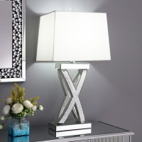 Bold interwoven lines create an Xshape base of this contemporary table lamp With a glamorous flair this stunning table lamp offers up a border of polished square tiles inset within a mirror trim silhouette design A flush top and bottom covered in mirror t