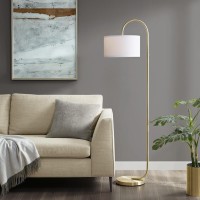 DetailsProduct FeaturesSoft and rounded arch paired with a clean drumshaped shade having a sleek minimalist modern and contemporary appealglamorous brass gold finish and matching round disc baseAdd this floor lamp on the side the sofa seat or end table or