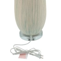 With a natural and comforting aesthetic this table lamp is a calm addition to your interior design The elongated rounded body with textured lines adds a finesse and creative look to it The elongated fabric drum shade filters light for a pleasant glow Sold