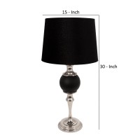 Featuring contemporary style this bold table lamp will stylizes your space like never before The turned style metal body with a matte black ball accent at the center brings the best out of this piece and makes it the focal point of attention The tapered r