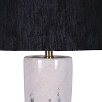 Elegant and artfully crafted this table lamp is a versatile statement piece for any bedroom living room or family space The subtly vase shaped base with a dual tone black and white painted finish give this piece uniqueness and character it will certainly 