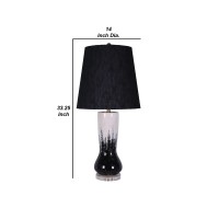 Elegant and artfully crafted this table lamp is a versatile statement piece for any bedroom living room or family space The subtly vase shaped base with a dual tone black and white painted finish give this piece uniqueness and character it will certainly 