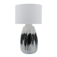 Elegant and artfully crafted this table lamp is a versatile statement piece for any bedroom living room or family space The subtly vase shaped base with a dual tone black and white painted finish give this piece uniqueness and class it will certainly be y