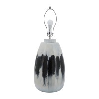 Elegant and artfully crafted this table lamp is a versatile statement piece for any bedroom living room or family space The subtly vase shaped base with a dual tone black and white painted finish give this piece uniqueness and class it will certainly be y