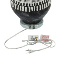 Elegant and artfully crafted this table lamp is a versatile statement piece for any bedroom living room or family space The dramatically tapered vase shaped base with a dual tone black and white tribal painted finish give this piece uniqueness and charact