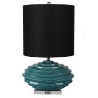 DescriptionAdd some dramatic but confident color to your favorite room with this uniquely crafted table lamp The elongated drum fabric shade rests atop the artistic faceted spiral base that is truly enticing to the eyes The blue green aqua hue gives a ple