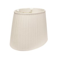 This 16 White Slanted Oval Paperback Linen Lampshade has a hint of traditional flair and will be a great addition to your lamp base This slant oval side pleat softback lampshade includes a standard washer fitter that fits over a standard harp and can be u